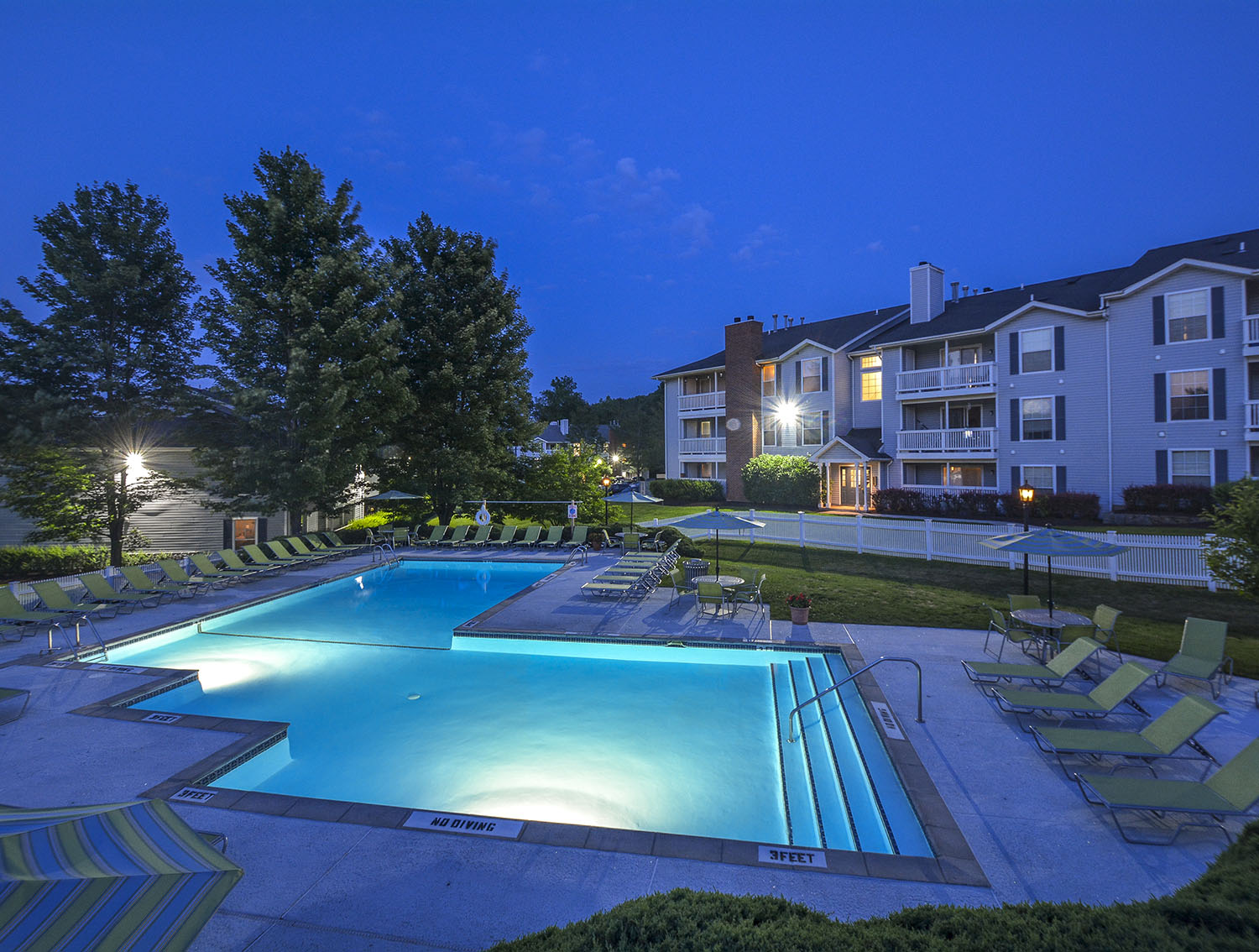 outdoor pool lit up at night