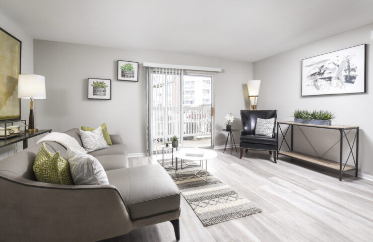 large living room with fire place and wood flooring
