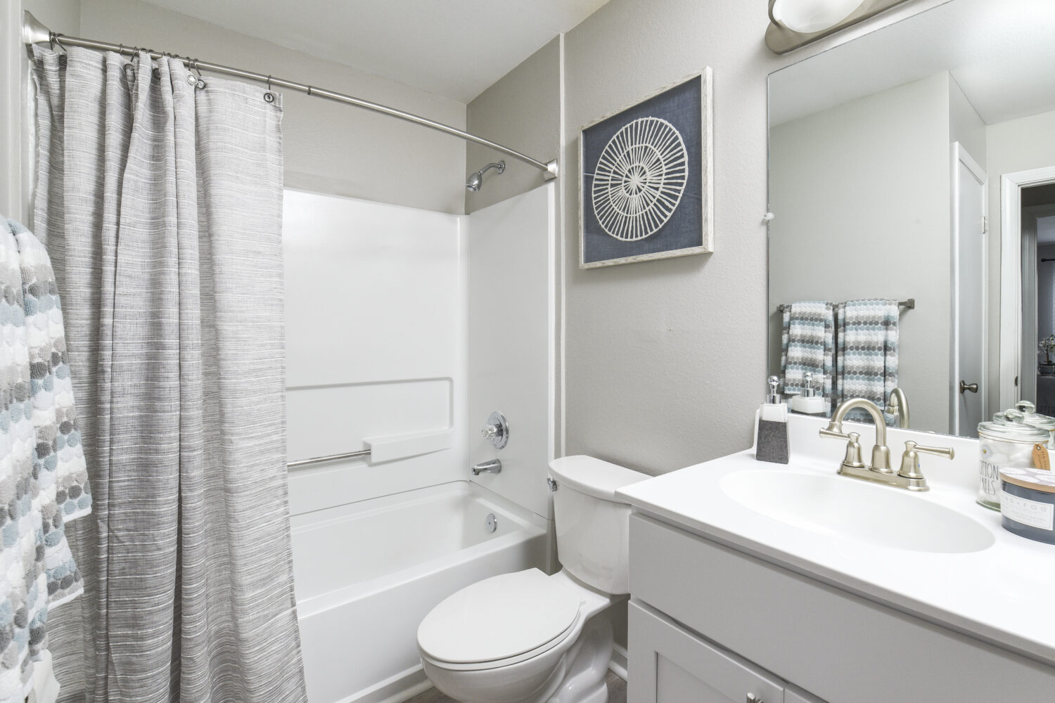 bathroom with white vanity and shower