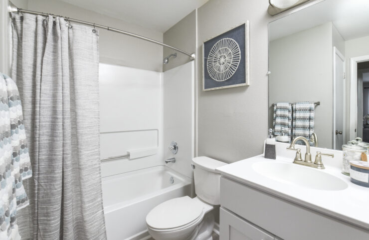 bathroom with white vanity and shower