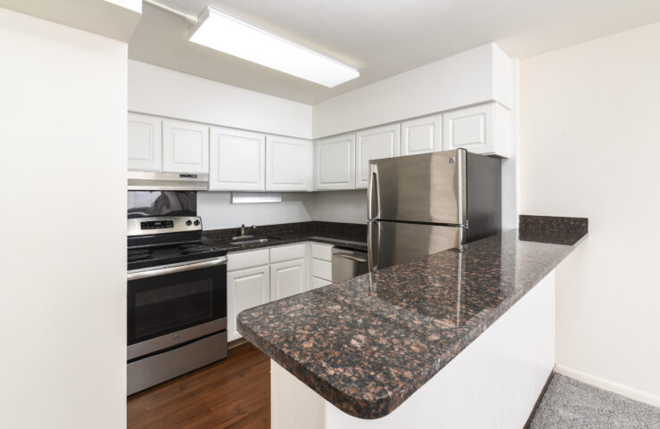 kitchen with white cabinets and granite countertops