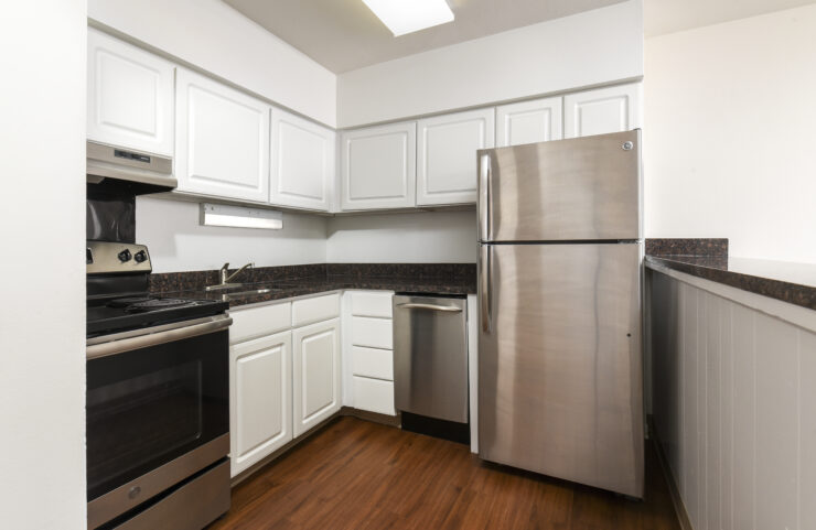 kitchen with white cabinets and plank flooring