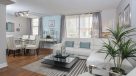 living room and dining room with plank flooring 