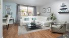 bright open living room with plank flooring 
