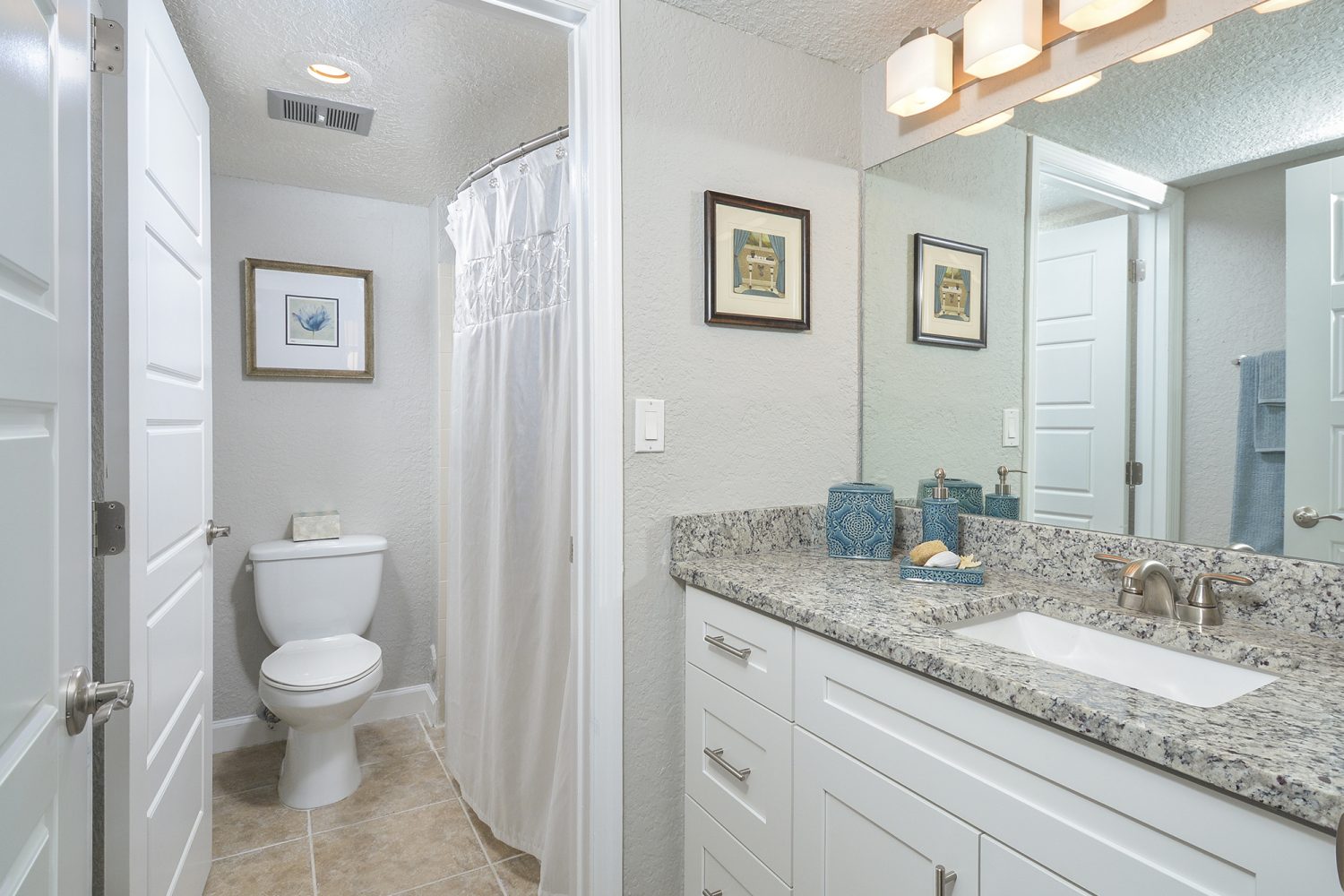 large white vanity outside the bathroom 