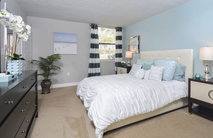 large bedroom with wall to wall carpet 