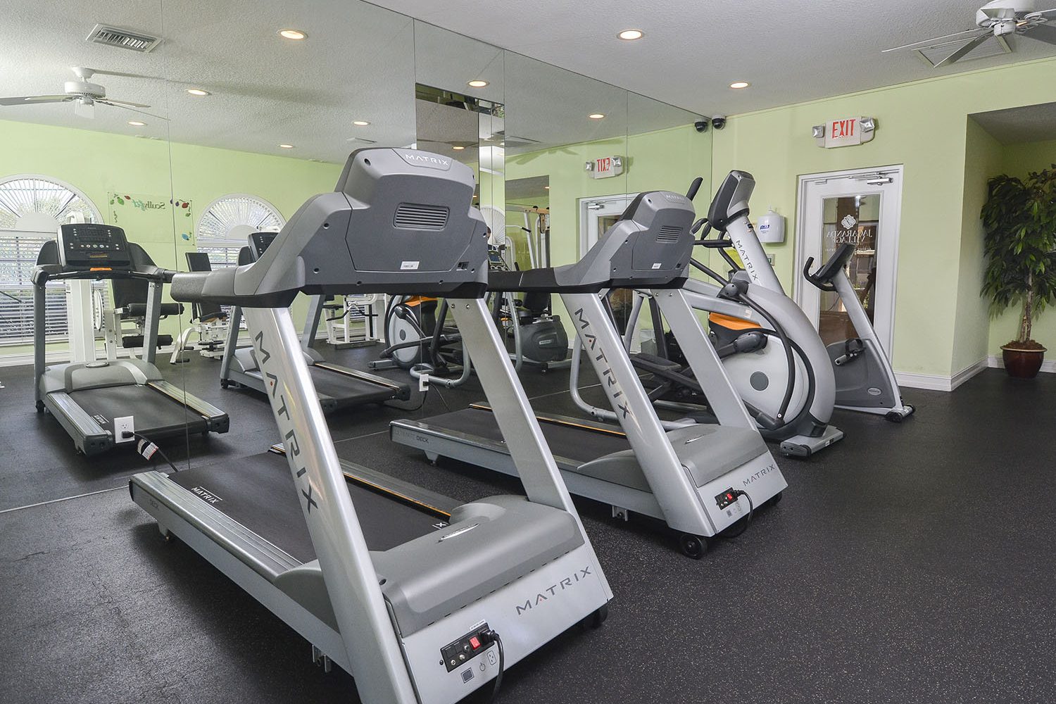 treadmills and elliptical machines in fitness center 