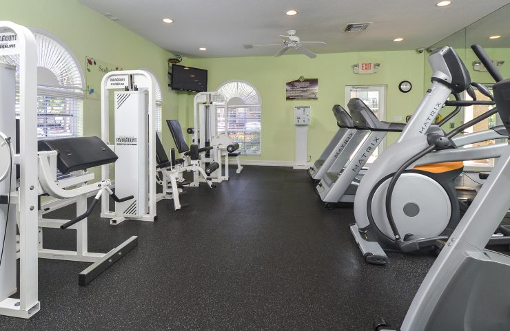 strength training and cardio machines in fitness center 