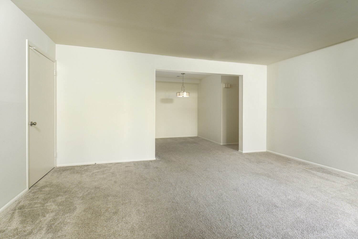 large living room with carpeting