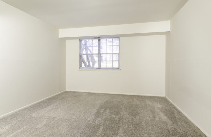 large bedroom with wall to wall carpet