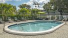 outdoor pool with lounge chairs 