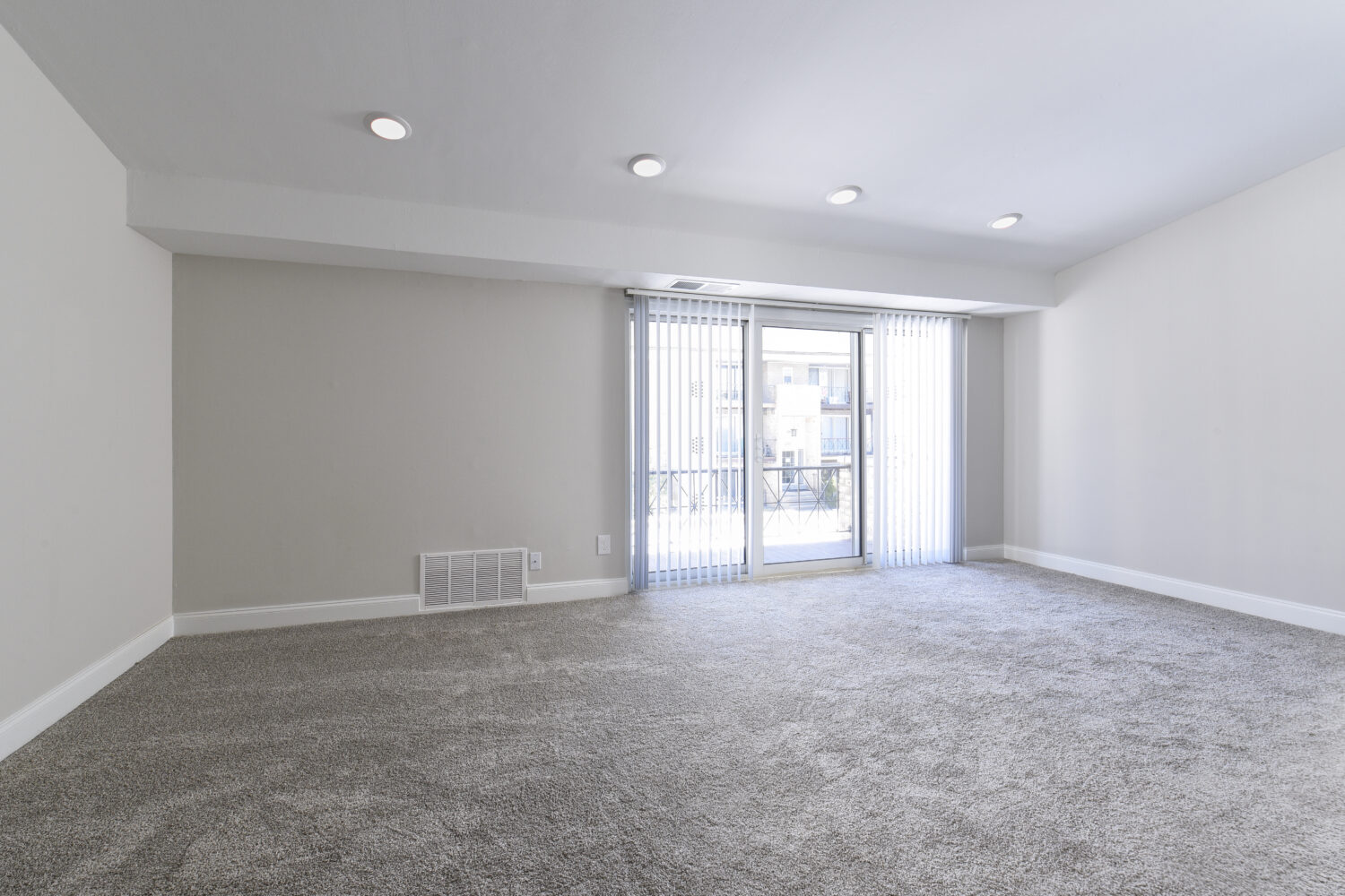 large living room with sliding doors to patio