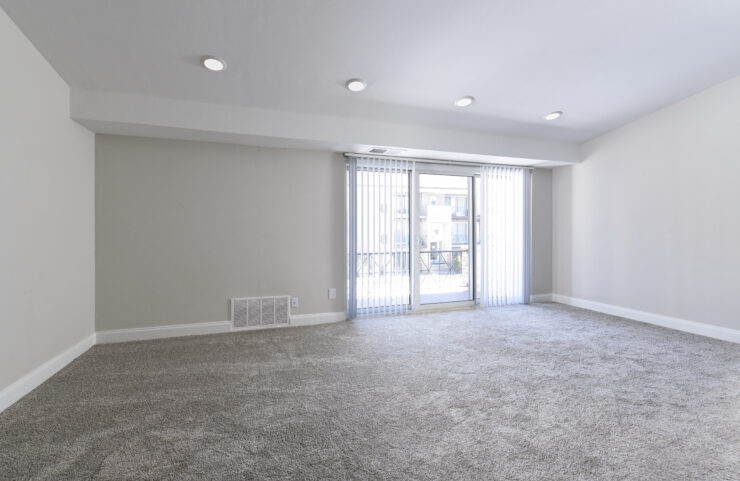 large living room with sliding doors to patio