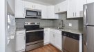 white elegant kitchen with stainless steel appliances