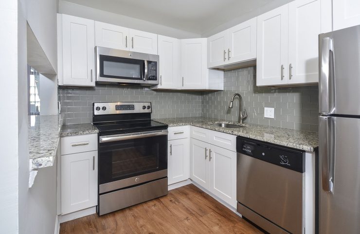 white elegant kitchen with stainless steel appliances