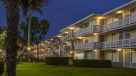 exterior photo of balconies well lit at night