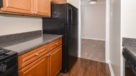 galley kitchen with hardwood floors 