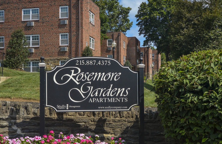 rosemore garden sign infront of stone wall 