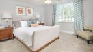 large bedroom with wall to wall carpet 