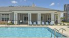 resort style pool with lounge chairs 