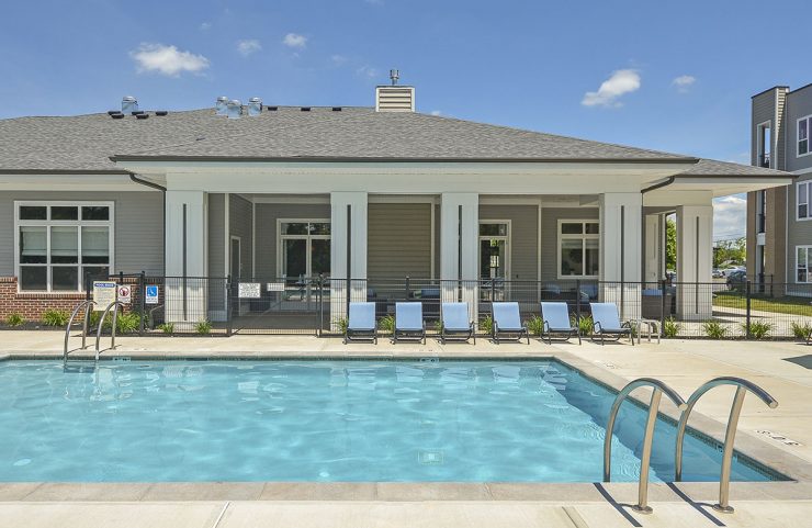 resort style pool with lounge chairs 