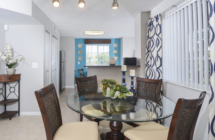dining room open to the kitchen with tile flooring 
