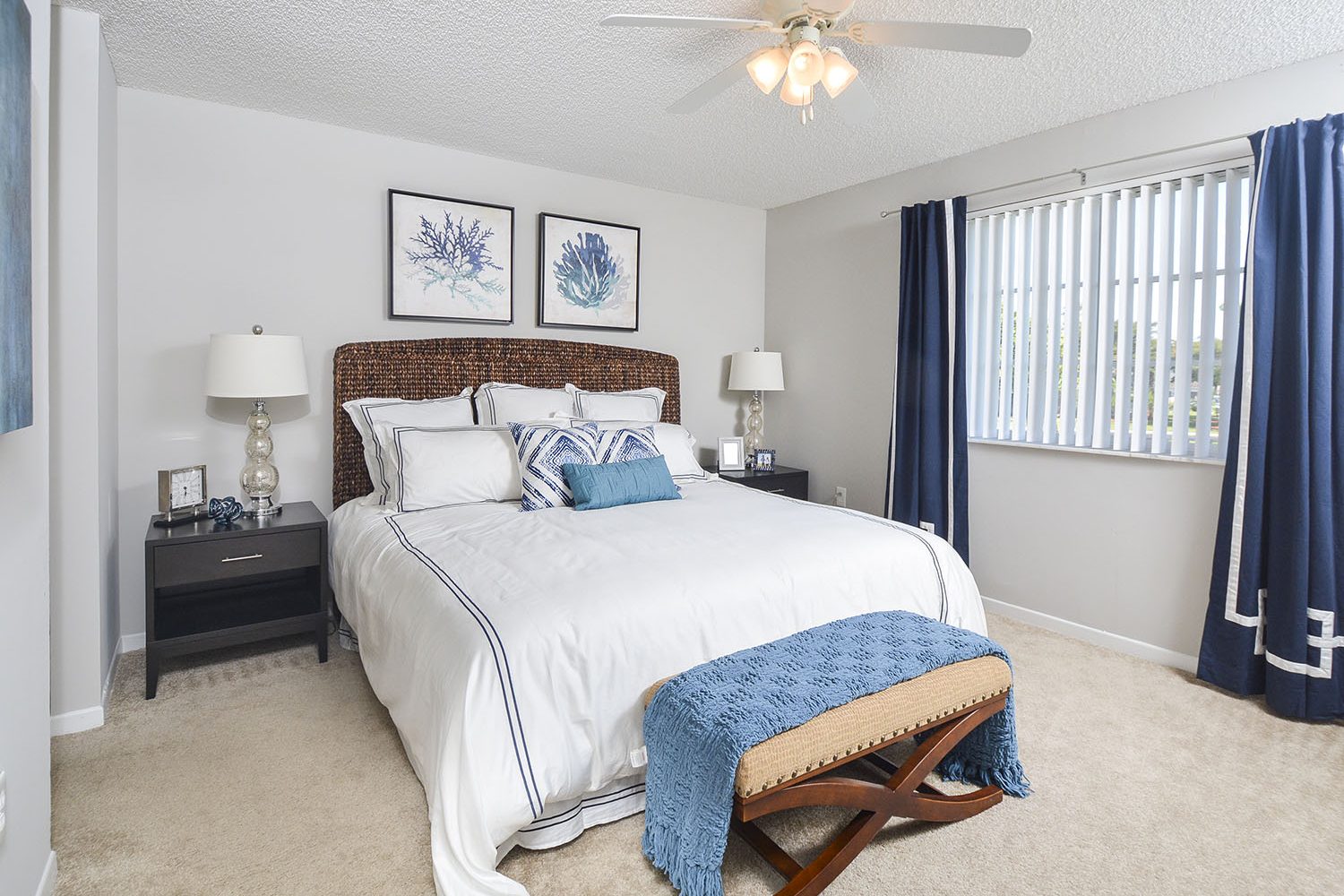 large bedroom with ceiling fans 