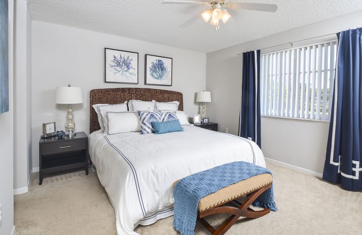 large bedroom with ceiling fans 