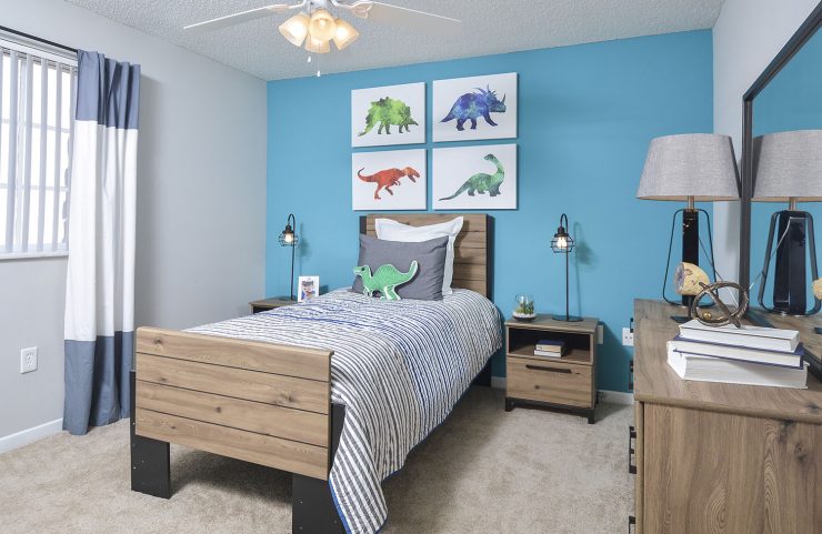 2nd bedroom with carpeting and ceiling fan 