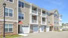 exterior photo of townhomes with garages 