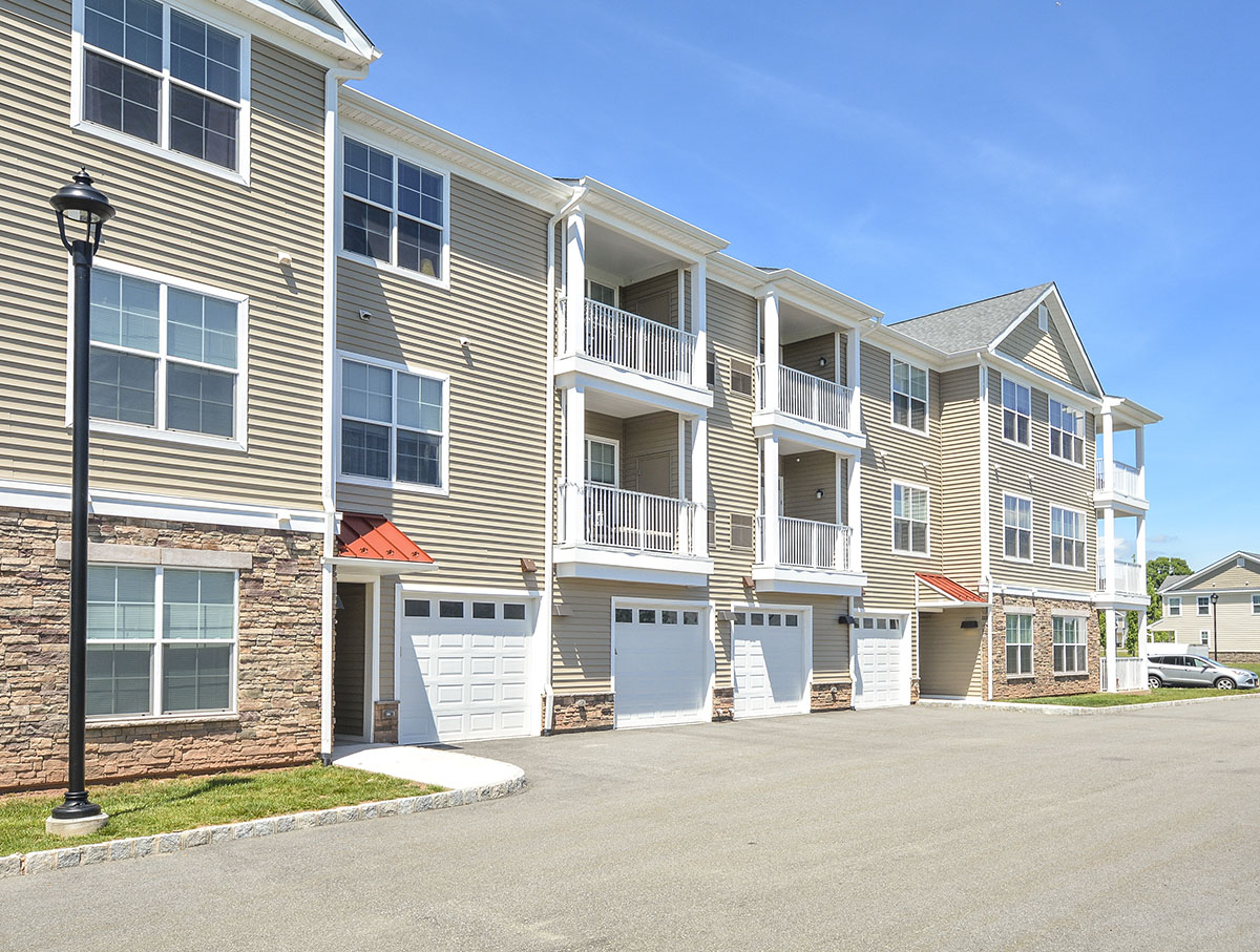 exterior photo of townhomes with garages 