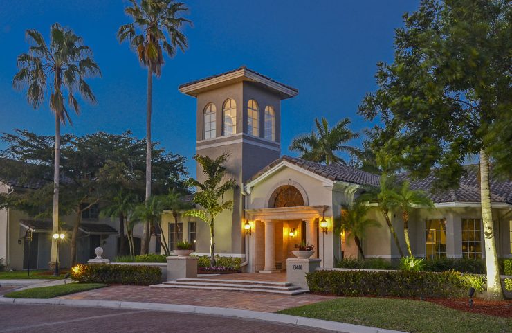 well lit leasing office entrance at night 