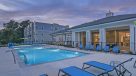 outdoor pool lit up at dusk 