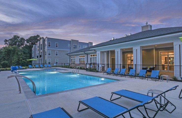 outdoor pool lit up at dusk 