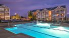 outdoor pool lit up at night 