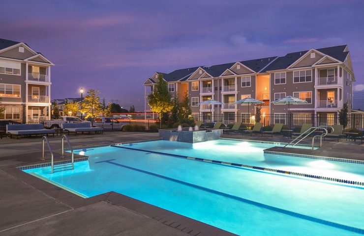 outdoor pool lit up at night 