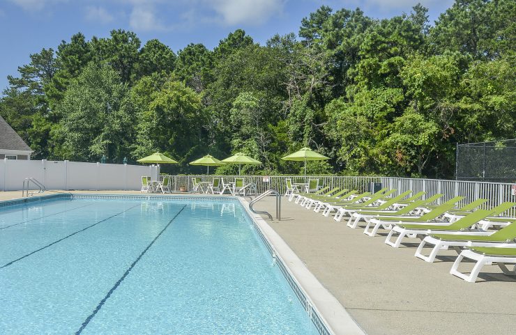 pool with lots of lounge chairs 