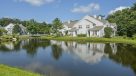apartments surrounding beautiful pond 