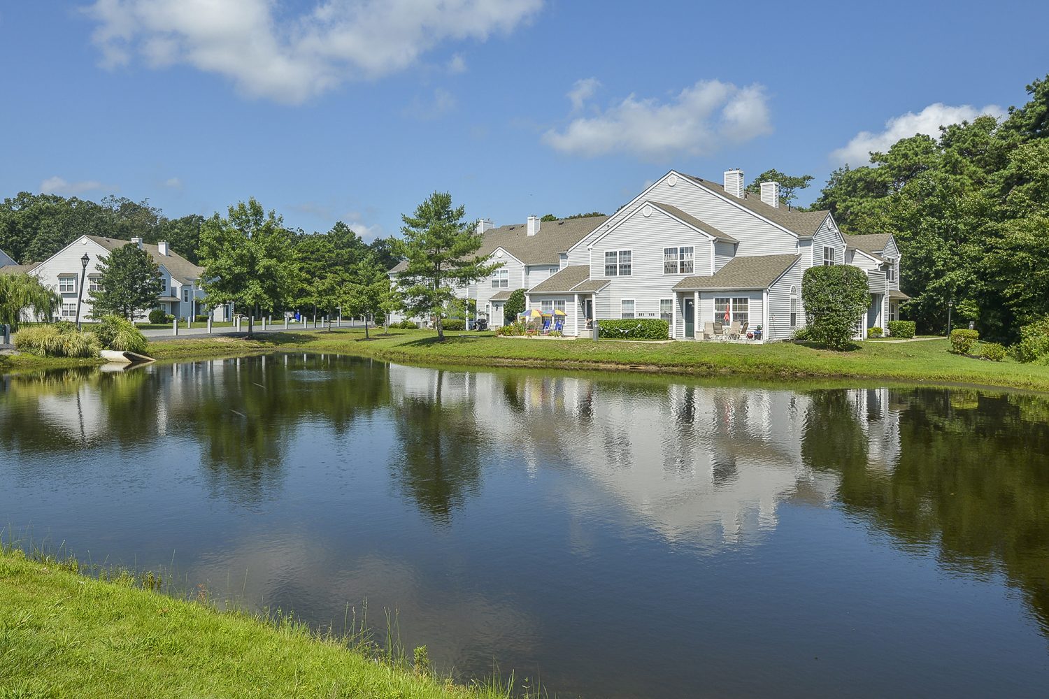 apartments surrounding beautiful pond