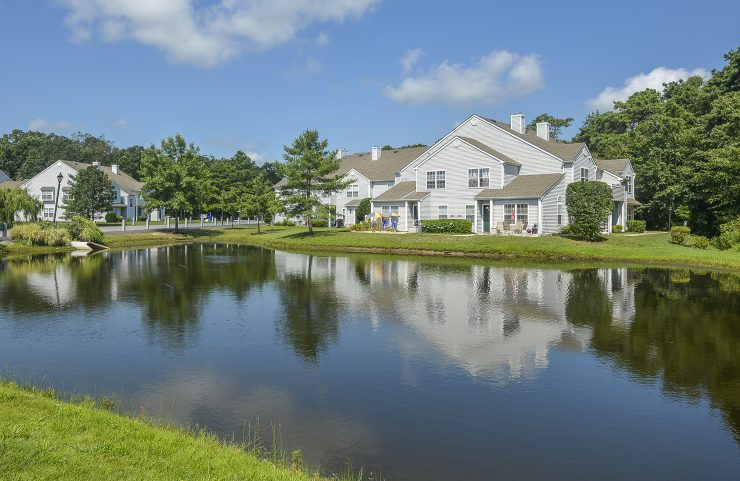 apartments surrounding beautiful pond 