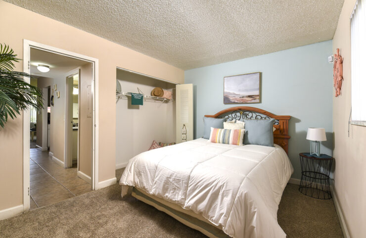 large carpeted bedroom with closet