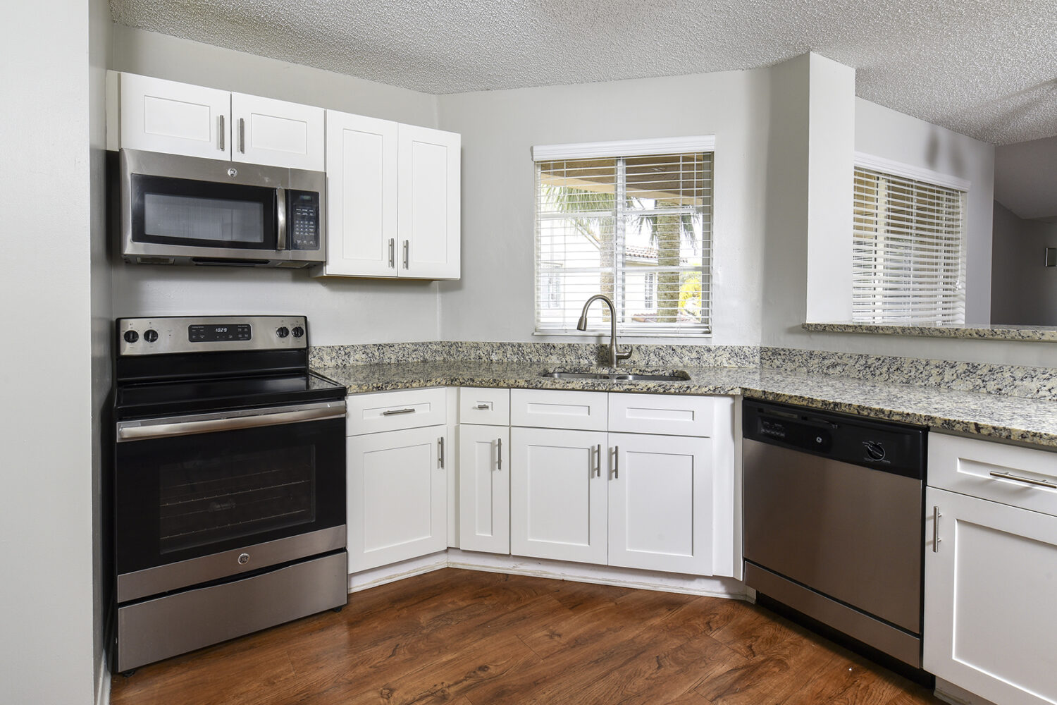 kitchen with white shaker cabinets and breakfast bar 