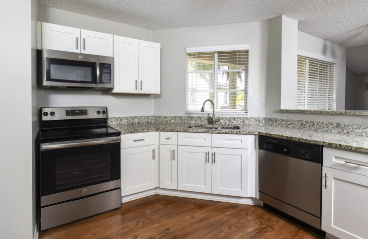 kitchen with white shaker cabinets and breakfast bar 