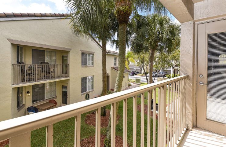 Balcony at Pembroke Cove overlooking palm trees