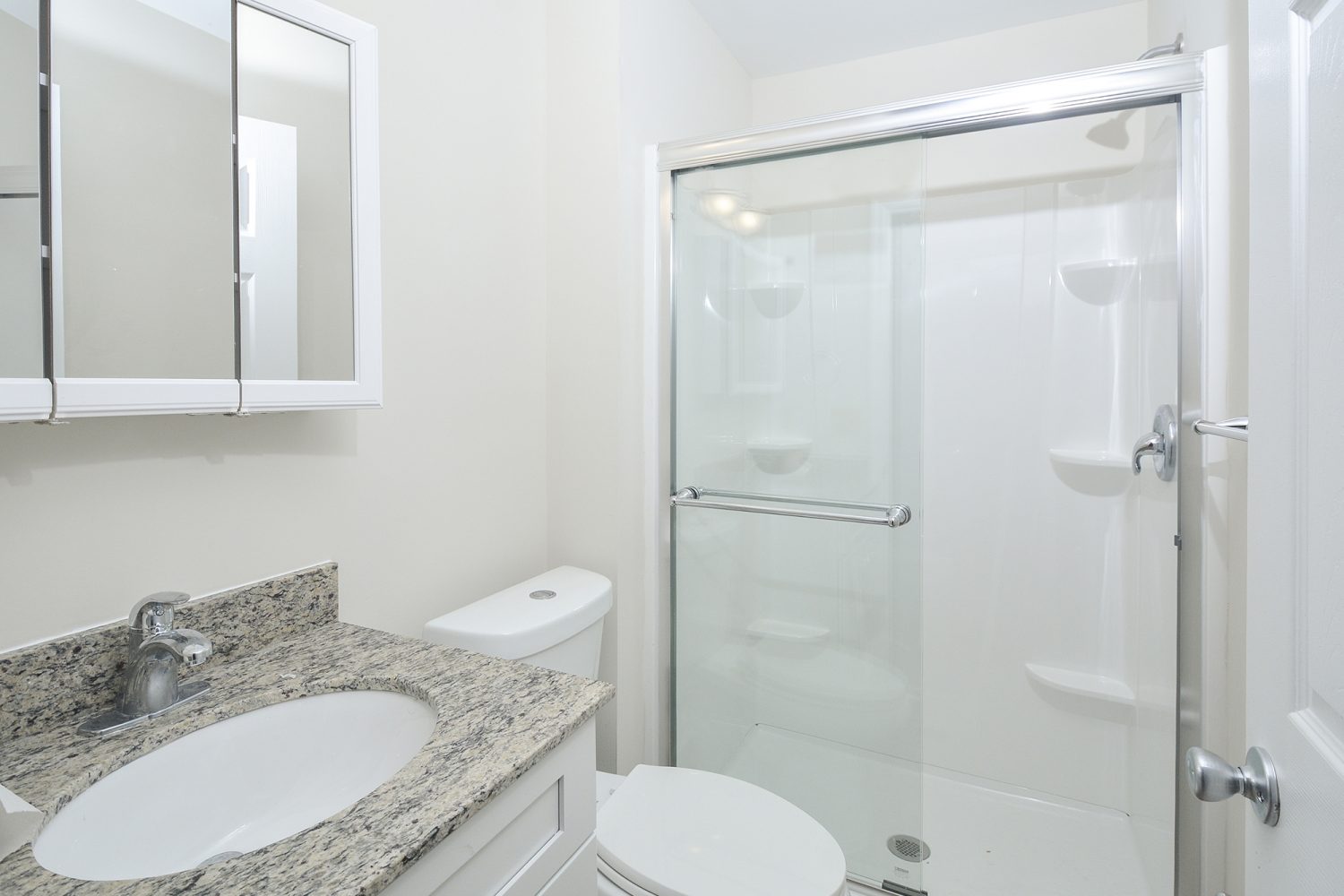 bathroom with white vanity and mirror