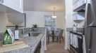 white kitchen cabinets with stainless steel appliances 