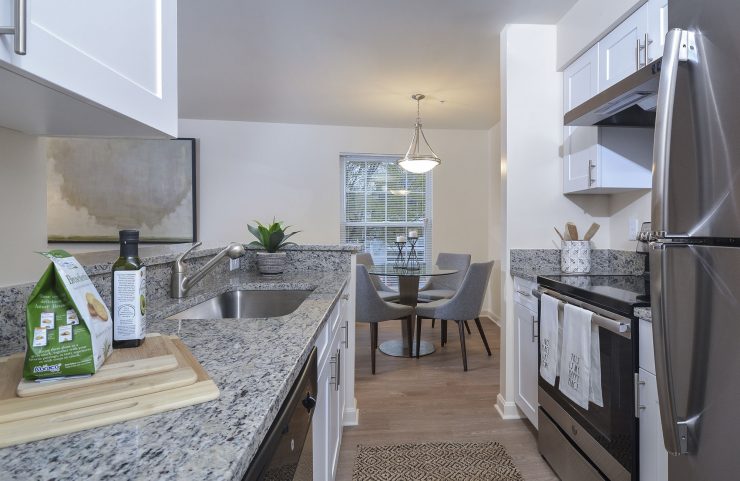 white kitchen cabinets with stainless steel appliances 