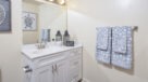 bathroom with modern fixtures and vanity 