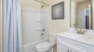 bathroom with white vanity and shower