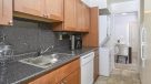 stackable washer and dryer in at the end of kitchen 